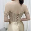 champagne satin formal dress with off-the-shoulder cowl neck and mermaid silhouette