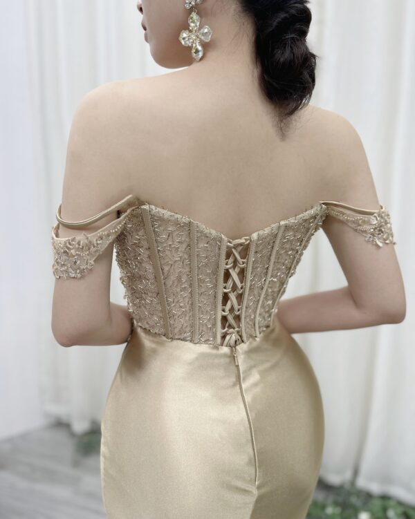 champagne satin formal dress with off-the-shoulder cowl neck and mermaid silhouette