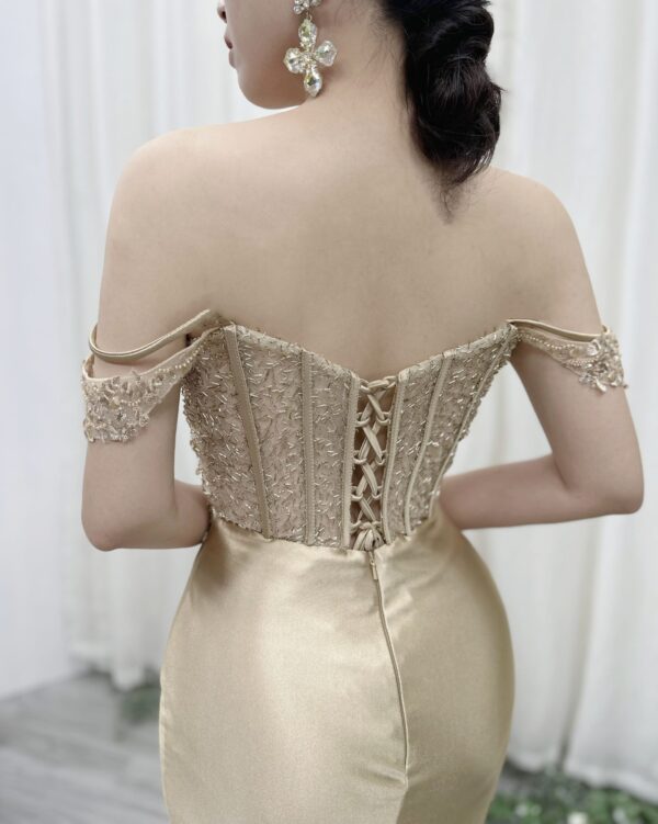 champagne satin formal dress with off-the-shoulder cowl neck and mermaid silhouette