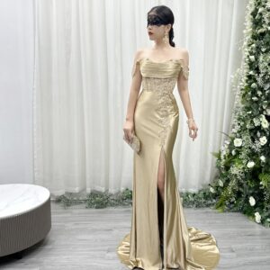 champagne satin mermaid evening gown with off-the-shoulder cowl neck and beaded lace applique