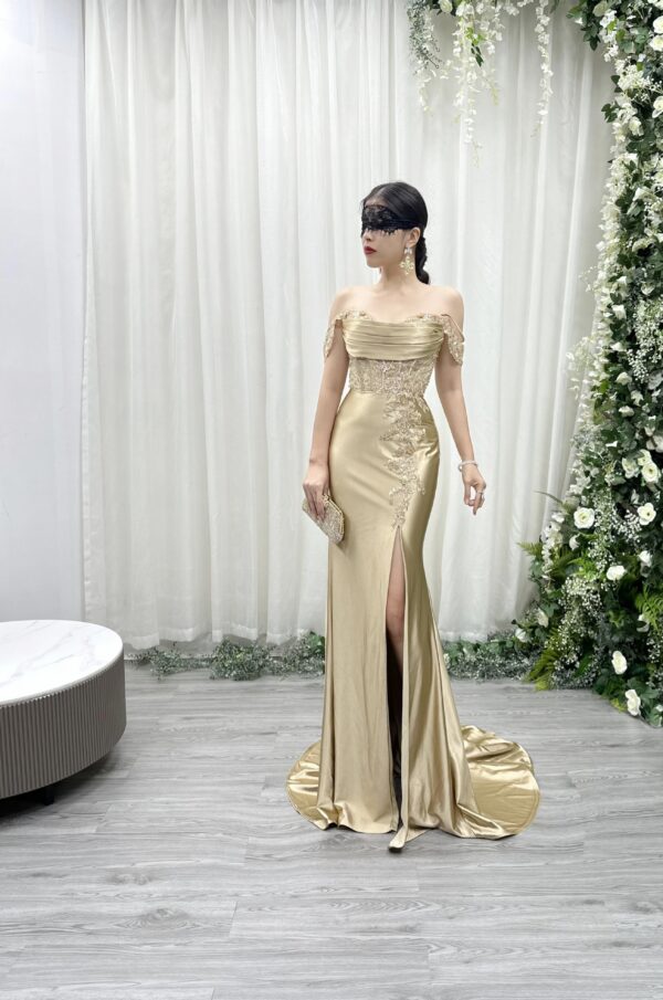 champagne satin mermaid evening gown with off-the-shoulder cowl neck and beaded lace applique