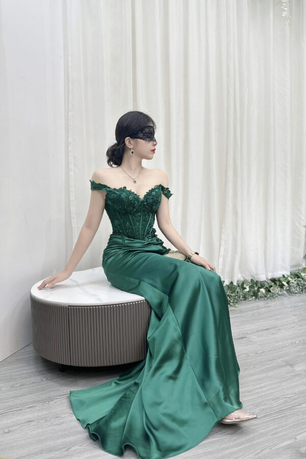emerald green satin formal gown with lace off-the-shoulder bodice and mermaid train