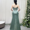 sage green satin formal gown with strapless cowl neck and mermaid train