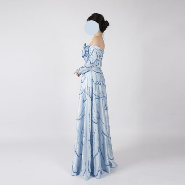 Light blue off-the-shoulder evening gown with 3D floral bodice, blue leaf beaded embroidery, long sheer sleeves, and floor-length satin skirt