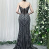 black beaded formal gown with sheer corset bodice and mermaid train