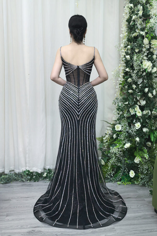 black beaded formal gown with sheer corset bodice and mermaid train