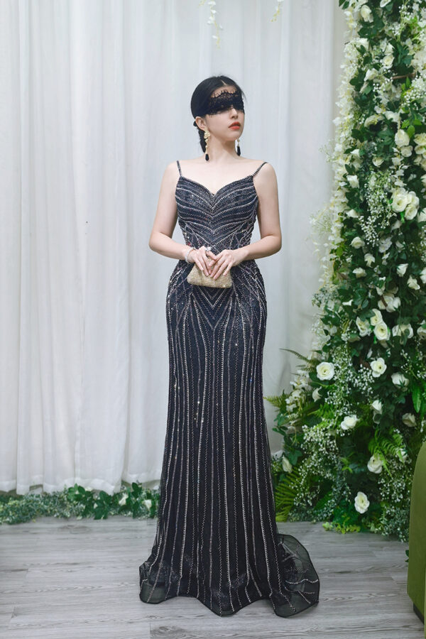 black beaded mermaid evening gown with spaghetti straps and chevron sequin details