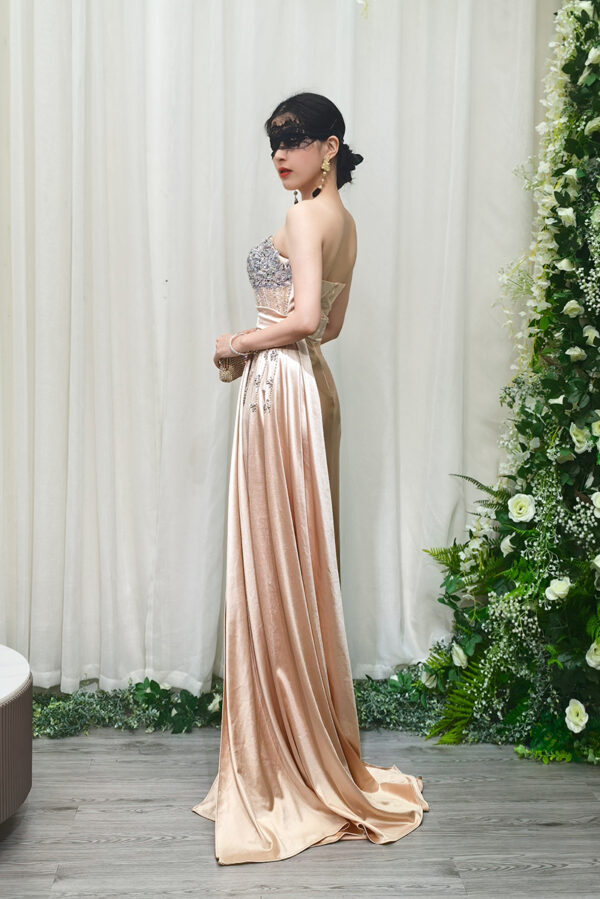 champagne beaded evening gown with satin mermaid skirt and side draping
