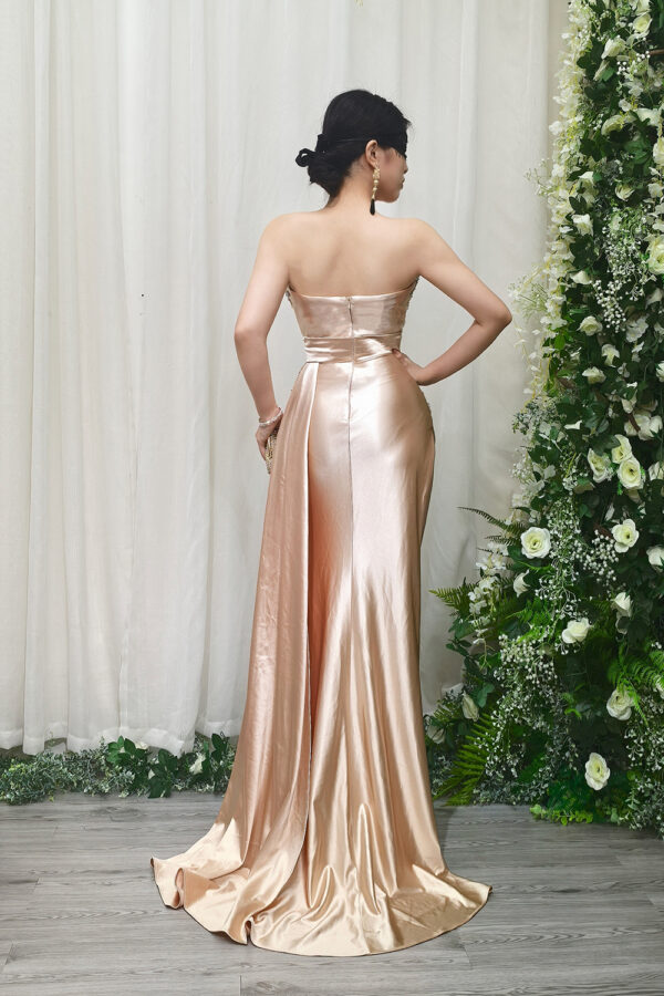champagne formal gown with beaded strapless bodice and mermaid silhouette