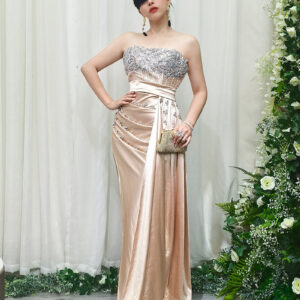 champagne satin mermaid evening gown with strapless beaded bodice and side draping