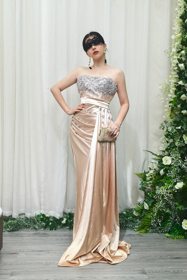 champagne satin mermaid evening gown with strapless beaded bodice and side draping