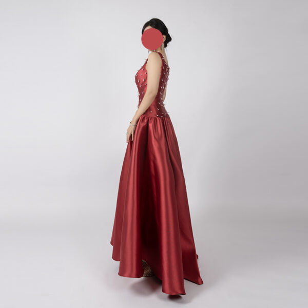 Luxe red satin ball gown with square neck, beaded bodice, and full floor-length skirt, formal evening wear for special occasions.