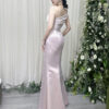 Luxury blush pink satin mermaid gown with one-shoulder neckline, ruched detailing, and dramatic high slit.