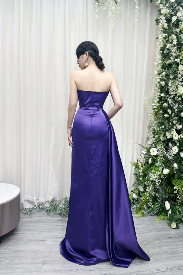 Luxury purple satin mermaid gown with strapless sweetheart neckline, ruched bodice, and dramatic high slit.