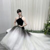 Modern black halter mermaid gown with ombre tulle skirt and dramatic trailing train.