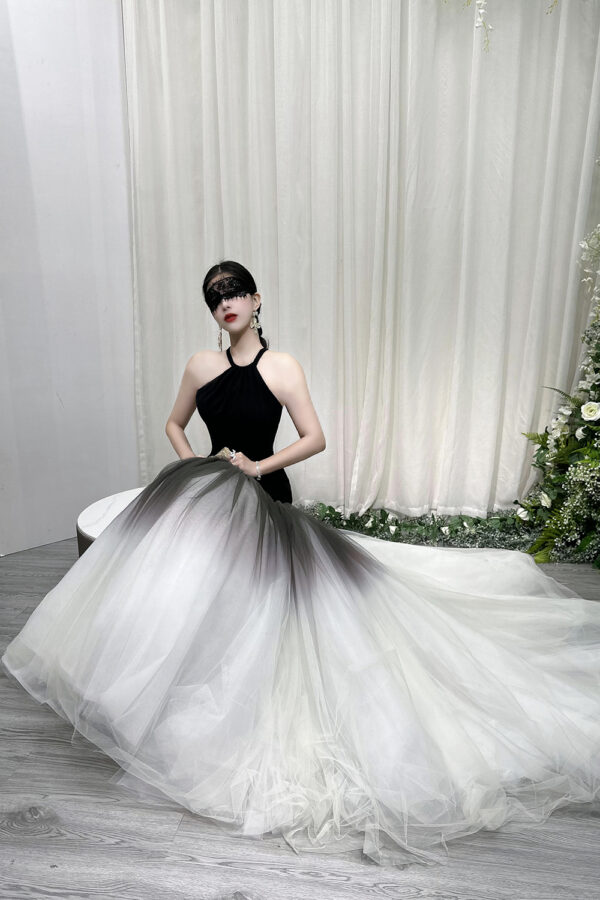 Modern black halter mermaid gown with ombre tulle skirt and dramatic trailing train.