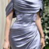 Modern dusty blue satin gown with off-the-shoulder neckline and high slit train.