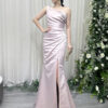 Romantic blush pink satin mermaid gown with one-shoulder neckline and flowing high-slit skirt.