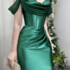 Romantic emerald green satin mermaid gown with off-the-shoulder design and corset bodice.