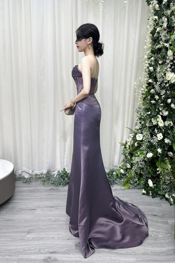 Romantic lavender strapless evening dress with lace corset bodice and floor-length satin train.