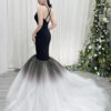 Elegant black halter mermaid dress with ombre tulle skirt and trailing train.