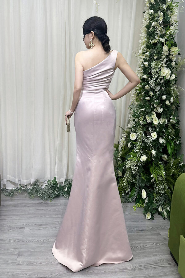 Elegant blush pink strapless satin evening dress with ruched bodice, high slit, and floor-length train.