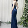 Elegant navy blue satin evening dress with beaded sheer bodice and high side slit.