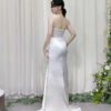 Elegant white satin mermaid dress with beaded sheer bodice and deep V-neck.