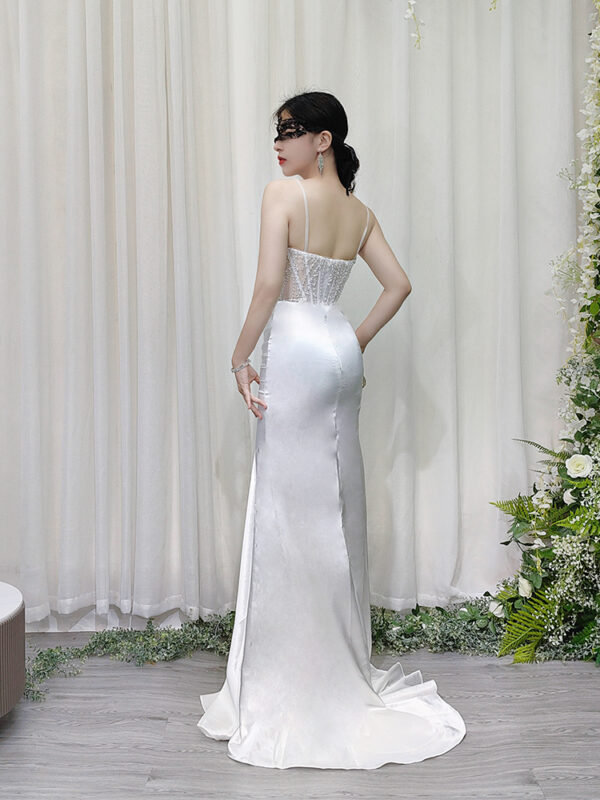 Elegant white satin mermaid dress with beaded sheer bodice and deep V-neck.