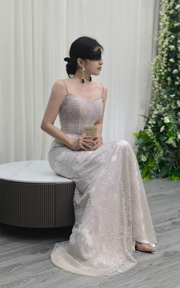 white beaded mermaid wedding dress with spaghetti straps and lace train