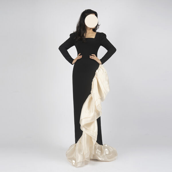 Black long sleeve mermaid prom dress with champagne organza ruffle detail, floor-length formal gown