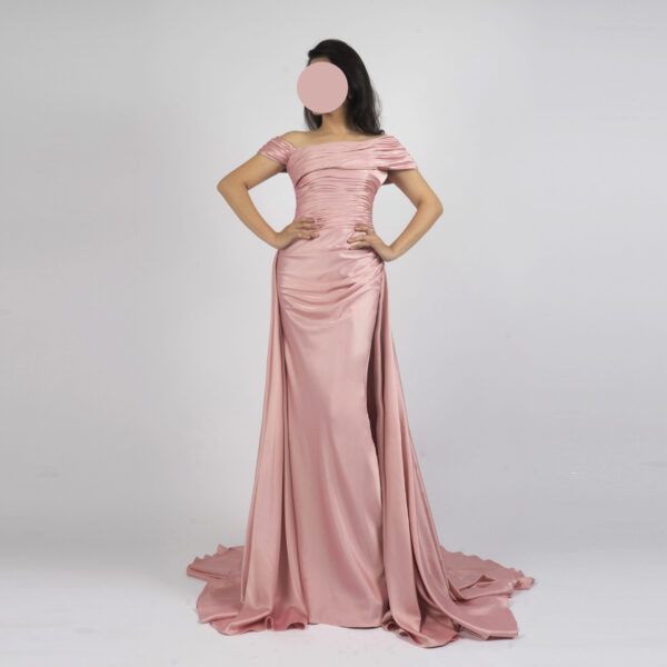 Elegant blush pink off-the-shoulder gown with pleated shoulders, ruched waist, and satin train