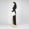 Luxury black mermaid formal gown with champagne organza ruffle and long sleeves, perfect for Dubai red carpet events