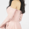 Soft blush off-the-shoulder mermaid gown with draped waist, long bell sleeves, and flowing satin train