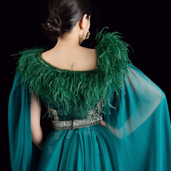 Luxe teal green mermaid evening dress with feather collar, beaded embroidery, and flowing sheer cape, formal wear for special occasions