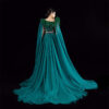 Regal emerald green mermaid gown with feathered neckline, silver beaded waist, and sheer chiffon cape train, bridal or gala formal wear