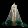 Luxury white mermaid gown with green floral embroidery and dramatic cape train