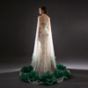 Sheer tulle cape evening dress with green floral beading and mermaid silhouette
