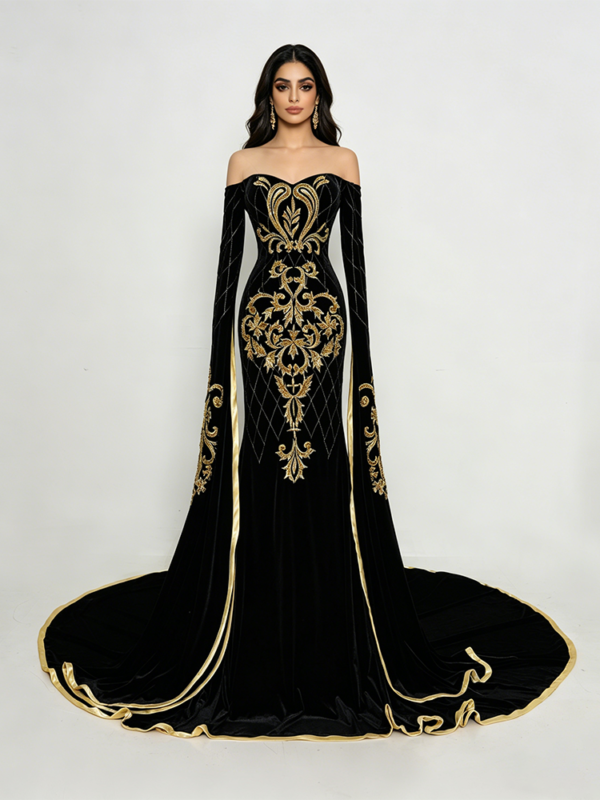 Black velvet evening gown with intricate gold embroidery, off-the-shoulder neckline and long bell sleeves, worn by a Middle Eastern model