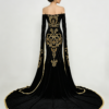 Back view of luxury black and gold mermaid dress with sweeping train, showing full gold embroidery details